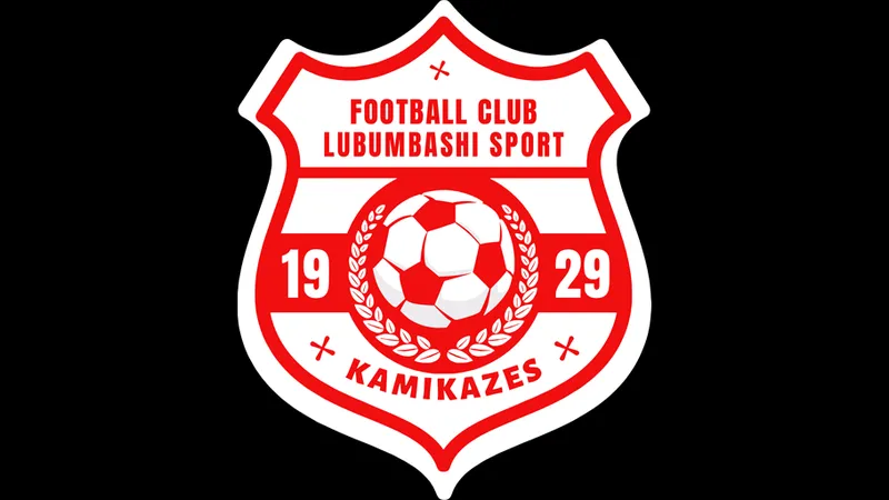 Cầu thủ của Lubumbashi Sport đang tìm cách vượt qua cầu thủ đối phương từ Manika